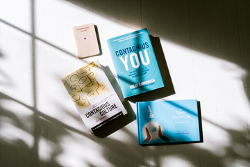 Anese Cavanaugh's books — Contagious Culture, Contagious You, and The Leader You Will Be — stacked together, each with bold typographic covers